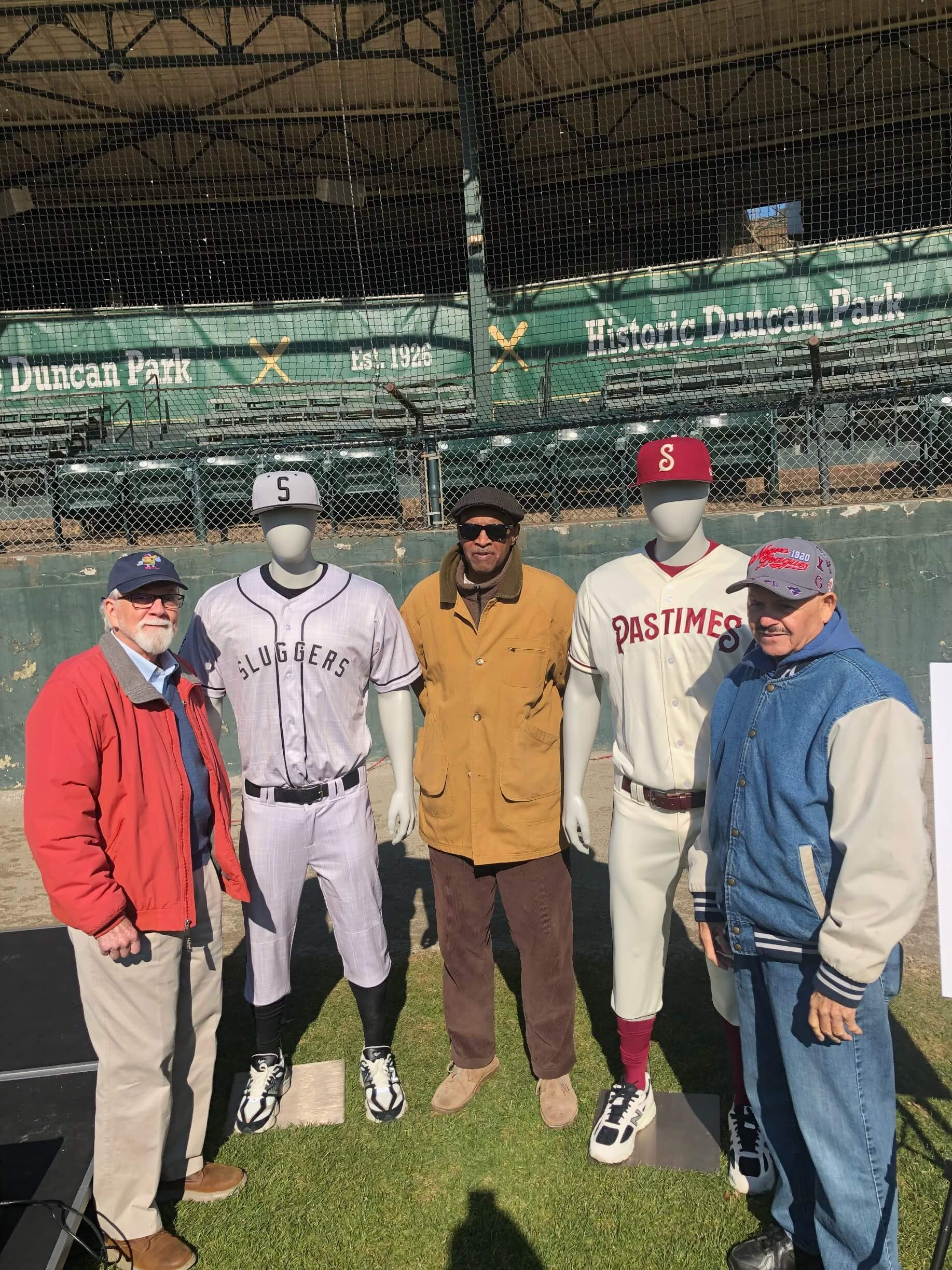 The author of this blog with Luther Norman (c) and softball legend Theodore “Strawberry” Williams (r) and two friends at the Pastimes launch