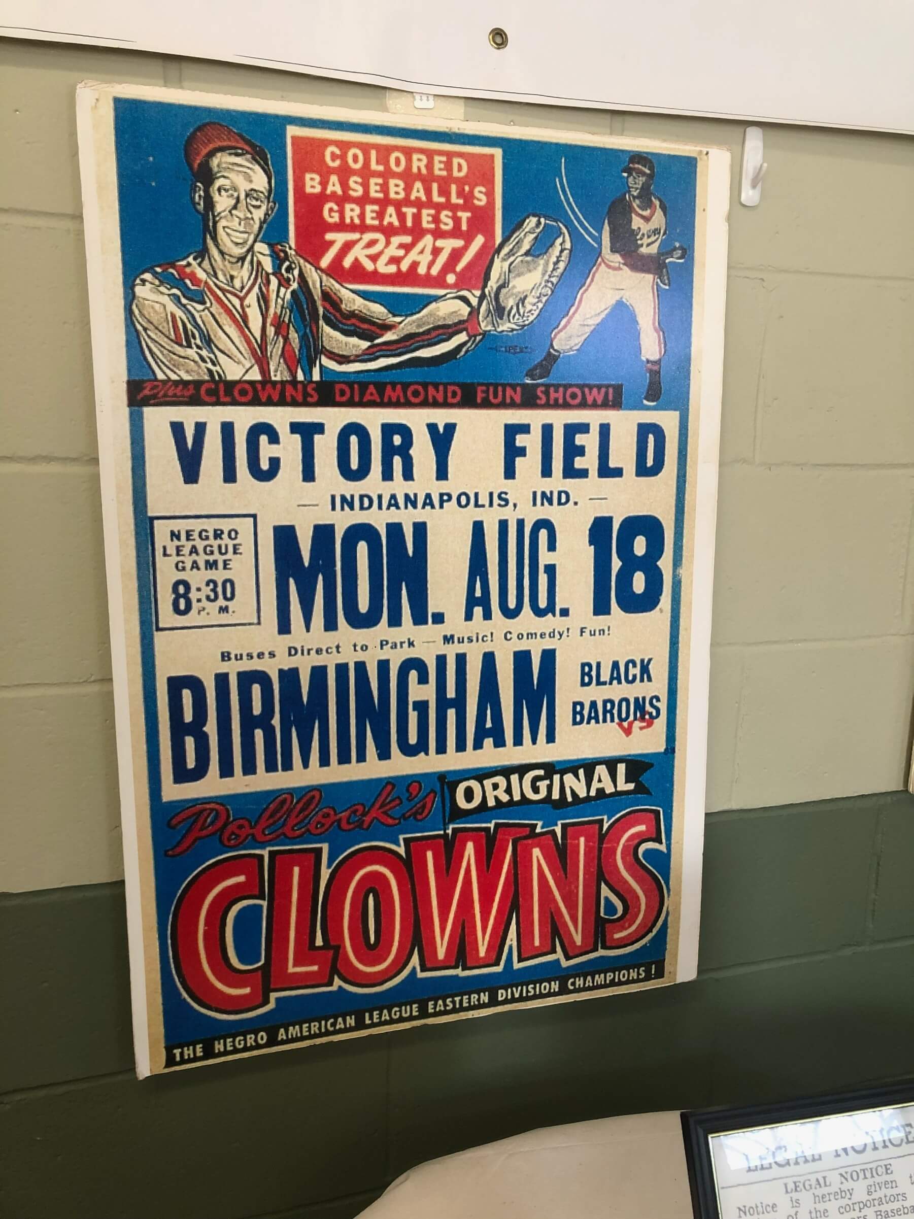A vintage baseball poster for a game at Victory Field in Indianapolis featuring the Birmingham Black Barons and Pollock's Original Clowns.